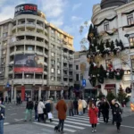People in front of the Corinthia Grand Hotel Du Boulevard in Central Bucharest
