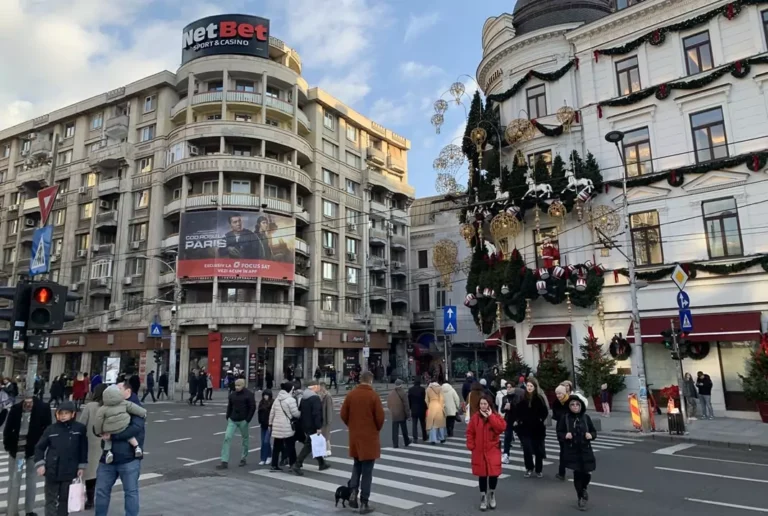 People in front of the Corinthia Grand Hotel Du Boulevard in Central Bucharest